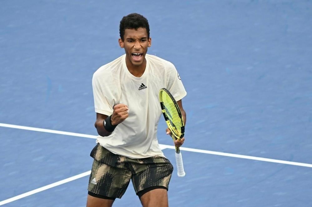 The Weekend Leader - Auger-Aliassime makes US Open semifinal as Alcaraz retires